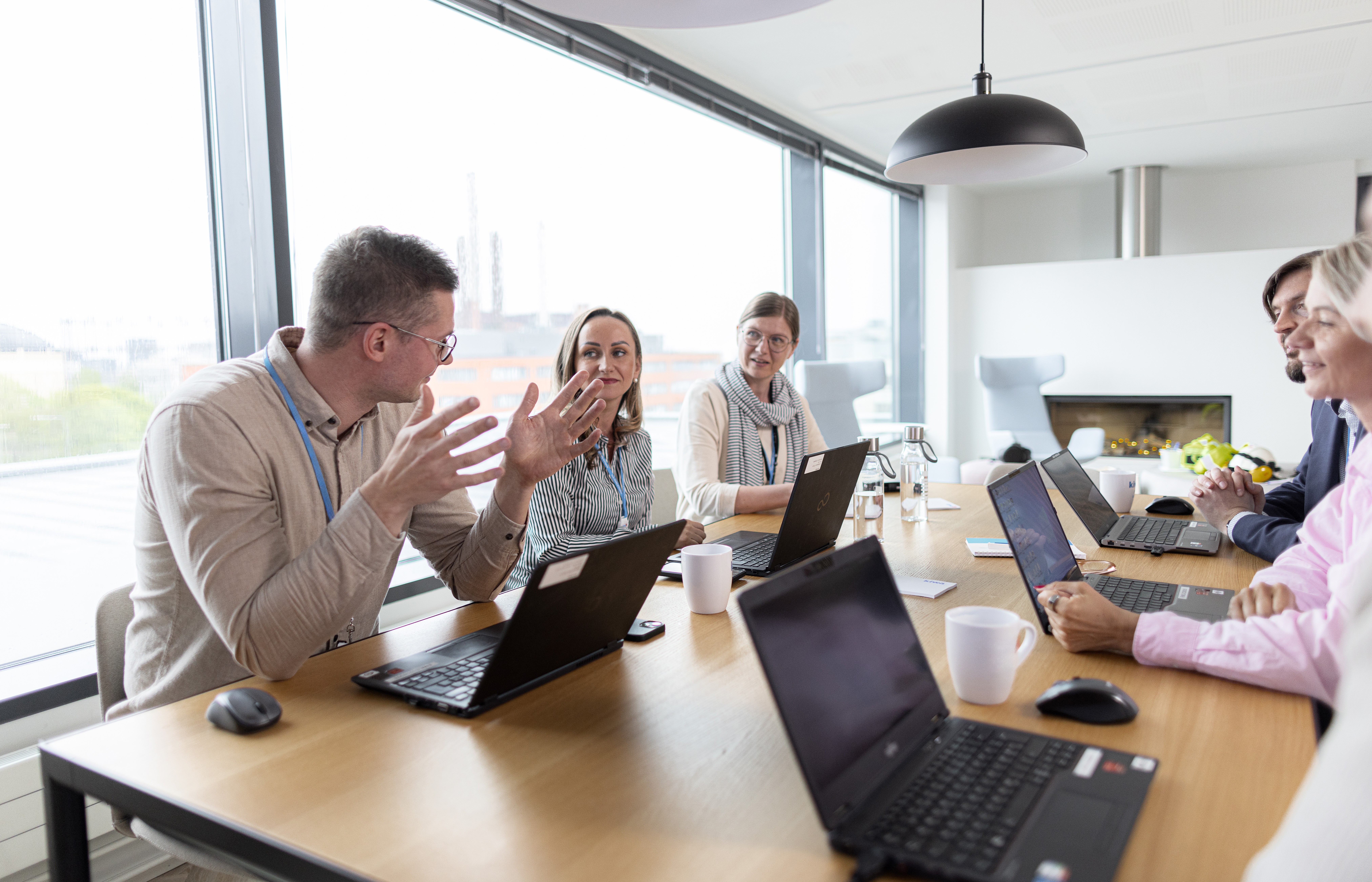 Colleagues at the office discussing at a table